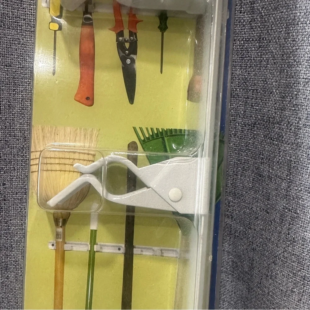 Symmetry spring grip Wall Organizer with White Holders. NWT.